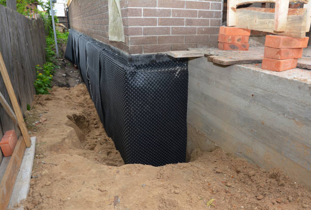 SJ Waterproofing Pros technician performing targeted Exterior Waterproofing assessment in Bainbridge, IN